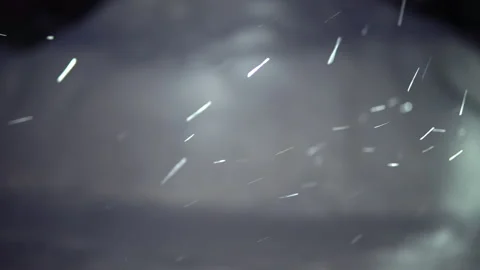 Car headlights lighting falling snow in the evening Stock Footage 146549380