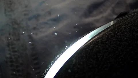 Car headlights lighting falling snow in the evening Stock Footage 146549628