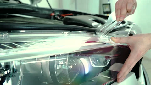 Car headlights polishing process. Video stock 94357599