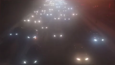 Car headlights through cloudy glass Stock Footage 168289563