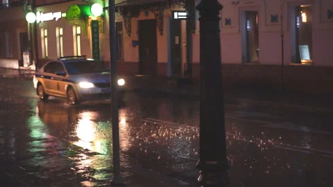 Car with the headlights turned on rides in the rain Stock Footage 115326584