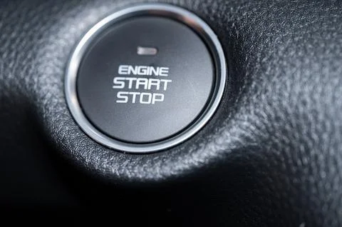 Car ignition button in a modern vehicle dashboard Stock Photos