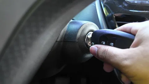 Car Ignition Close Up – Hand Turning Key to Start Engine Stock Footage 343694807