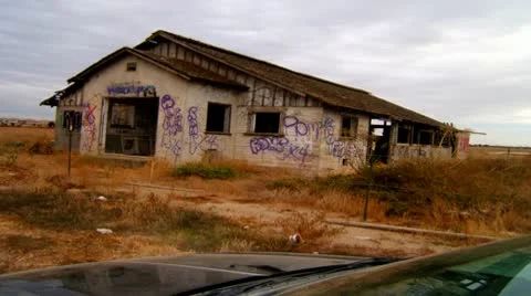 Car Infront Of Old Building With Graffiti Stock Footage 10019931