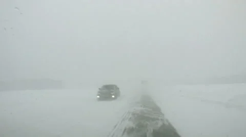 Car inside view point to winter road at blizzard POV Stock-Footage 48006022