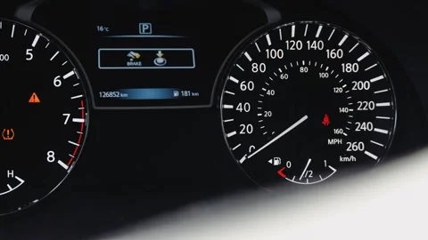 Car instrument cluster showing low tire pressure and safety warning lights Stock Footage 337582765
