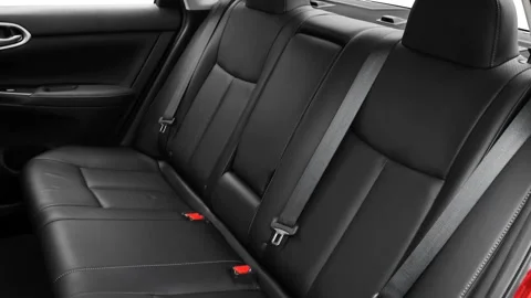 Car interior with back seats and seatbelts  2016 Nissan Sentra SL Video stock 159878599
