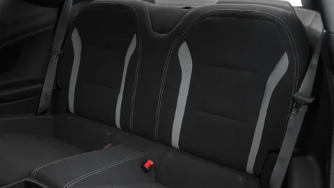 Car interior with back seats and seatbelts  2016 Chevrolet Camaro 1LT Stock Footage 159887687