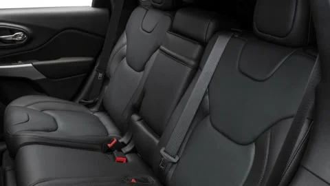 Car interior with back seats and seatbelts  2017 Jeep Cherokee Overland Stock Footage 159922714
