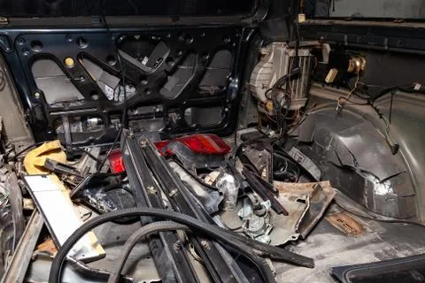Car interior in the back of a van with a disassembled lining, seats removed,  Foto stock