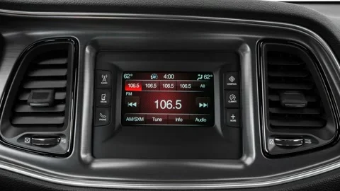Car interior with board and build in radio  2016 Dodge Challenger SXT Video stock 159853584