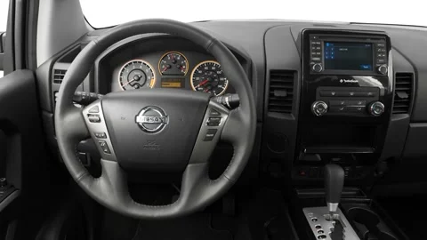 Car interior with board and steering wheel in studio 2015 Nissan Titan SV Stock Footage 159860543