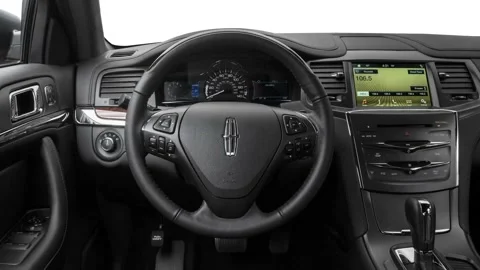 Car interior with board and steering wheel in studio 2016 Lincoln MKS Stock Footage 159878203