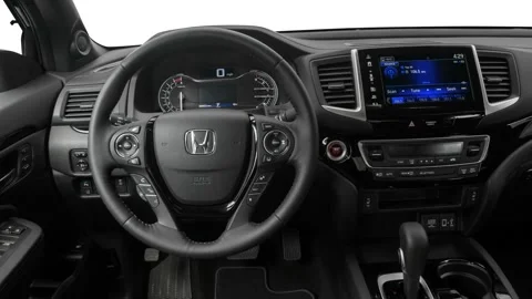 Car interior with board and steering wheel 2017 Honda Ridgeline Black Edition Stock Footage 159900915