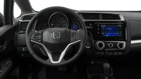 Car interior with board and steering wheel in studio 2017 Honda Fit EX-L Video stock 159917349