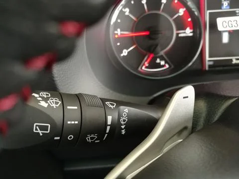 Car interior design windshield spray system and wiper blade control Fotos de archivo