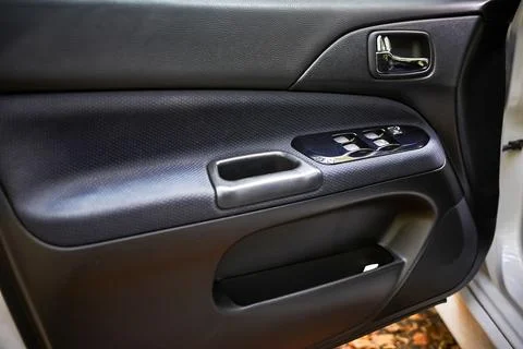 Car interior door panel with power controls Stock Photos