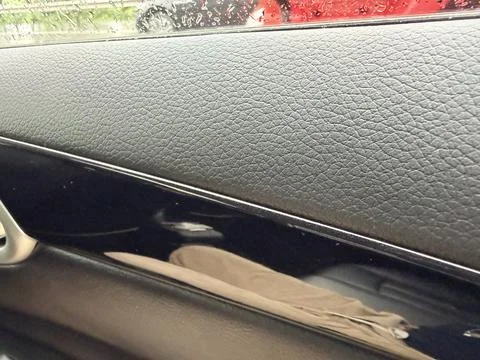 Car Interior Door Panel with Raindrops on Window Stock Photos