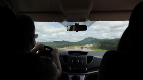Car interior driving mountains slowmotion highway man woman beautiful Stock Footage 156157559