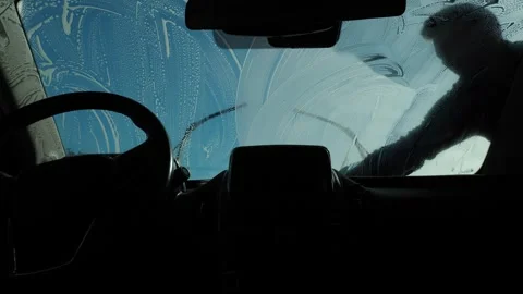 Car interior during windshield wash with soapy streaks Stock Footage 337041809