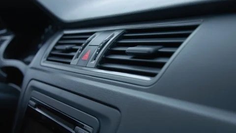 Car interior, emergency light button, air conditioning. slow motion Stock Footage 104885132