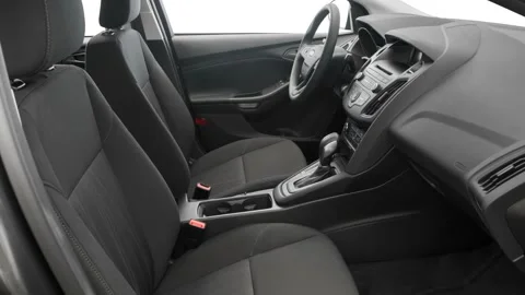 Car interior with front seats and board wide shot 2016 Ford Focus S Stock Footage 159860008