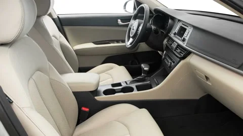 Car interior with front seats and board wide shot 2016 Kia Optima LX 1.6T Stock Footage 159860982