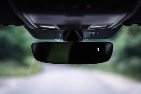 Car Interior Rear View Mirror with Compass Display Stock Photos