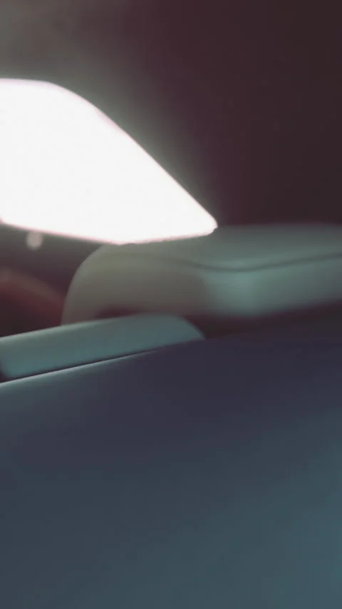 Car interior showing part of the back seat and window during a drive Stock Footage 337967499