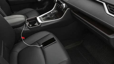 Car interior with smartphone plugged into charger  2019 Toyota RAV4 Limited Video stock 160053695