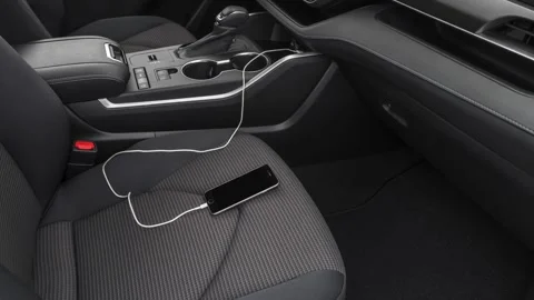 Car interior with smartphone plugged into charger  2020 Toyota Highlander LE CUV Stock Footage 160107976