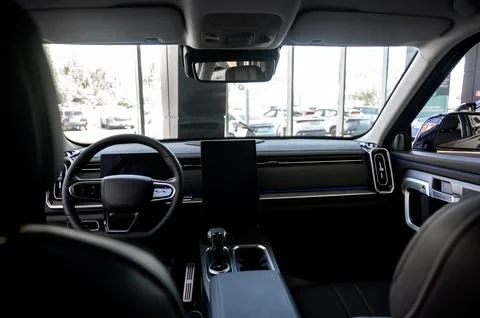 Car interior - steering wheel, shift lever and dashboard. Car modern inside. Stock Photos