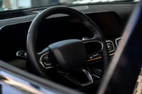 Car interior - steering wheel, shift lever and dashboard. Car modern inside. Stock Photos