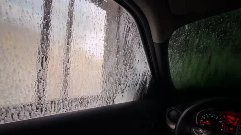 Car Interior View During Automatic Car Wash with Soap and Water Spray Stock Footage 331182378