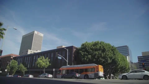 Car intersection with green trees in Los Angeles 4k Stock Footage 153391333