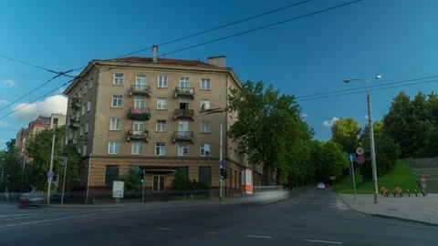 Car intersection at summer with Soviet era buildings, Vilnius, Lithuania, 4k Stock Footage 93134387