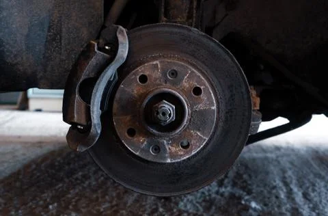 Car on a jack without a wheel Stock Photos