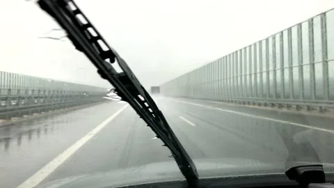 Car jacks from inside of the car at heavy rain on the road. Stock Footage 132858928