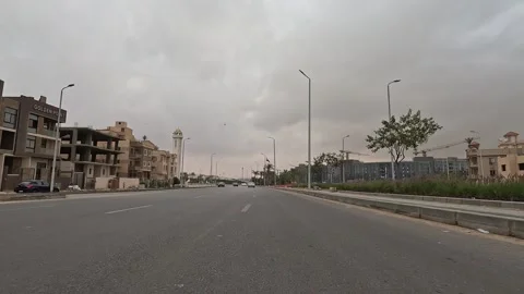 Car Journey Through Broad Roads New Cairo Showing Buildings Traffic Vehicles And Stock-Footage 330111906