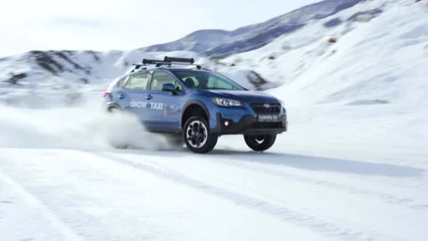 Car jumping on snow Stock Footage 236423031