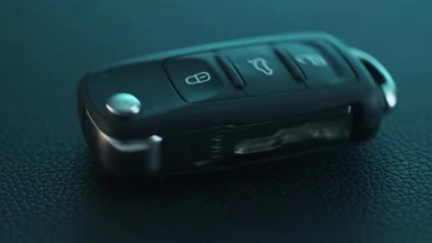 Car Key are spinning on Dark Surface. Stock Footage 261985188