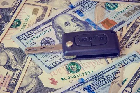 Car key on a background of dollars Stock Photos