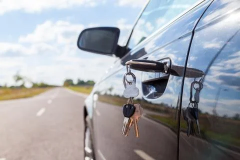 Car key on car lock Stock Photos
