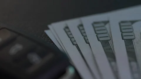 Car key with Dollars. Stock Footage 261985318