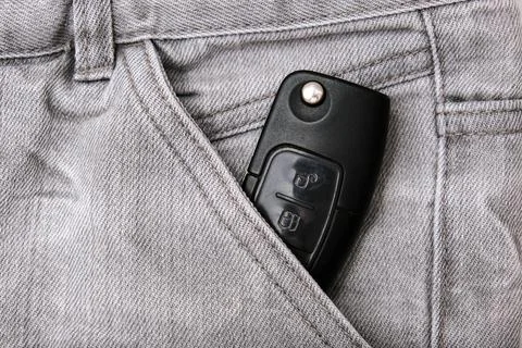 Car key, engine ignition key left in jeans pocket after coming home, weak sec Stock Photos