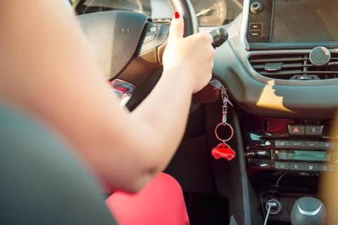 Car key in ignition. Start, stop or accelerate engine. Car shape keyfob on ve Stock Photos
