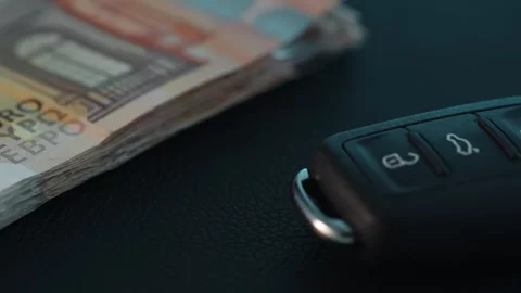 Car key next to a stack of money. Stock Footage 266899982
