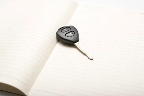 Car key on notebook Stock Photos