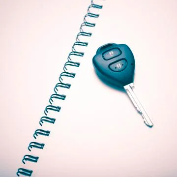 Car key on notebook Stock Photos