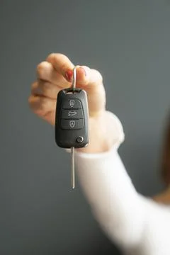 Car Key Remote Control with Key Extended in Hand Close-Up. Vehicle Access Фото